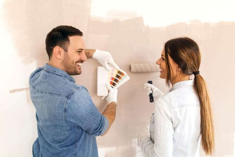 Couple Painting a Wall